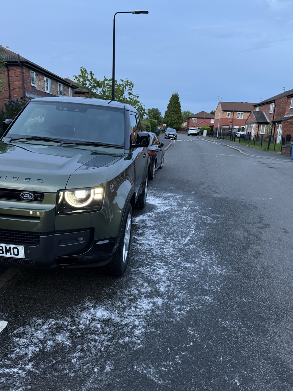 A Land Rover Defender with mirror-gloss bodywork after detailing