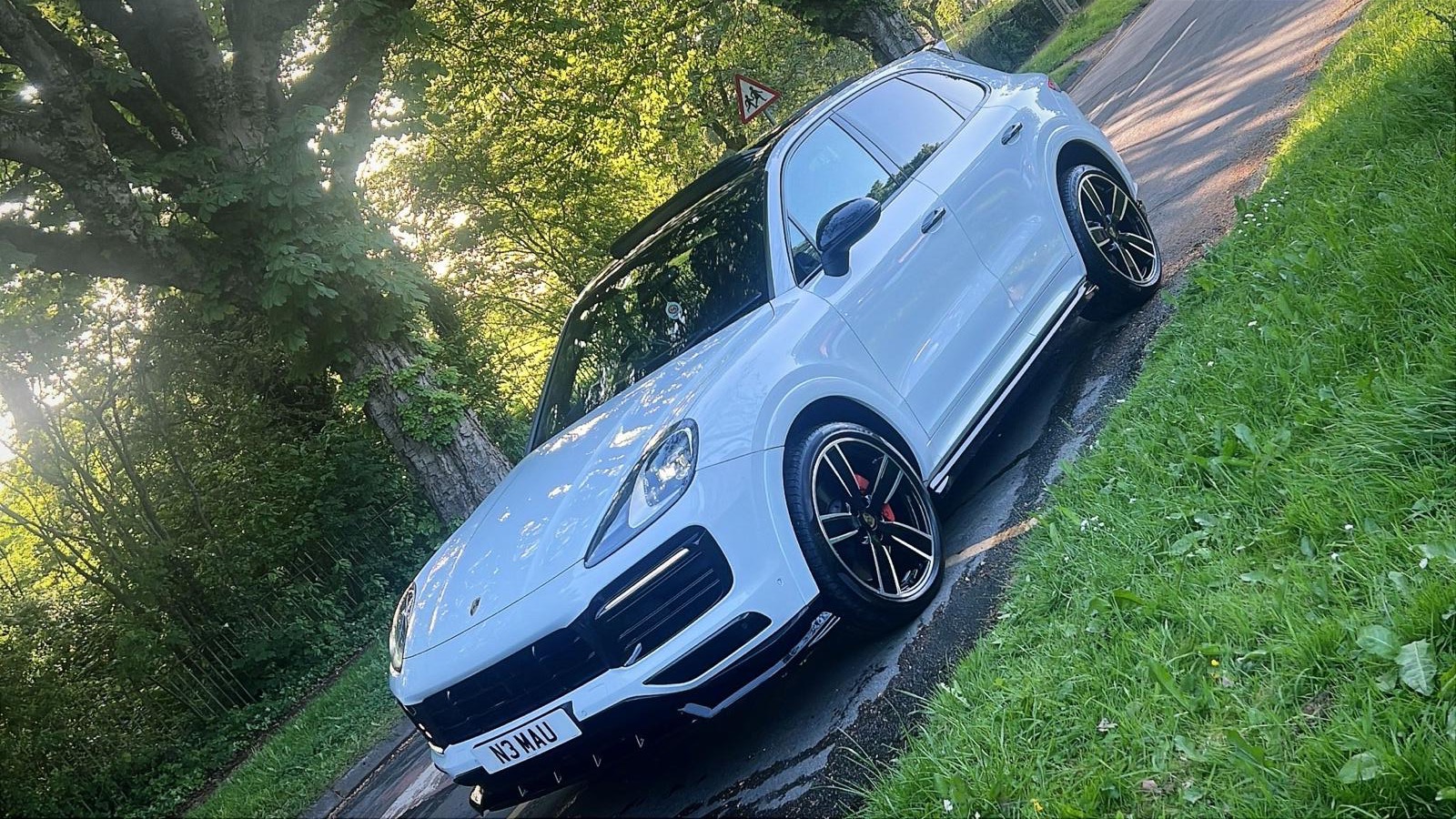 A white Porsche Cayenne with a showroom shine after a full valet by DR Elite