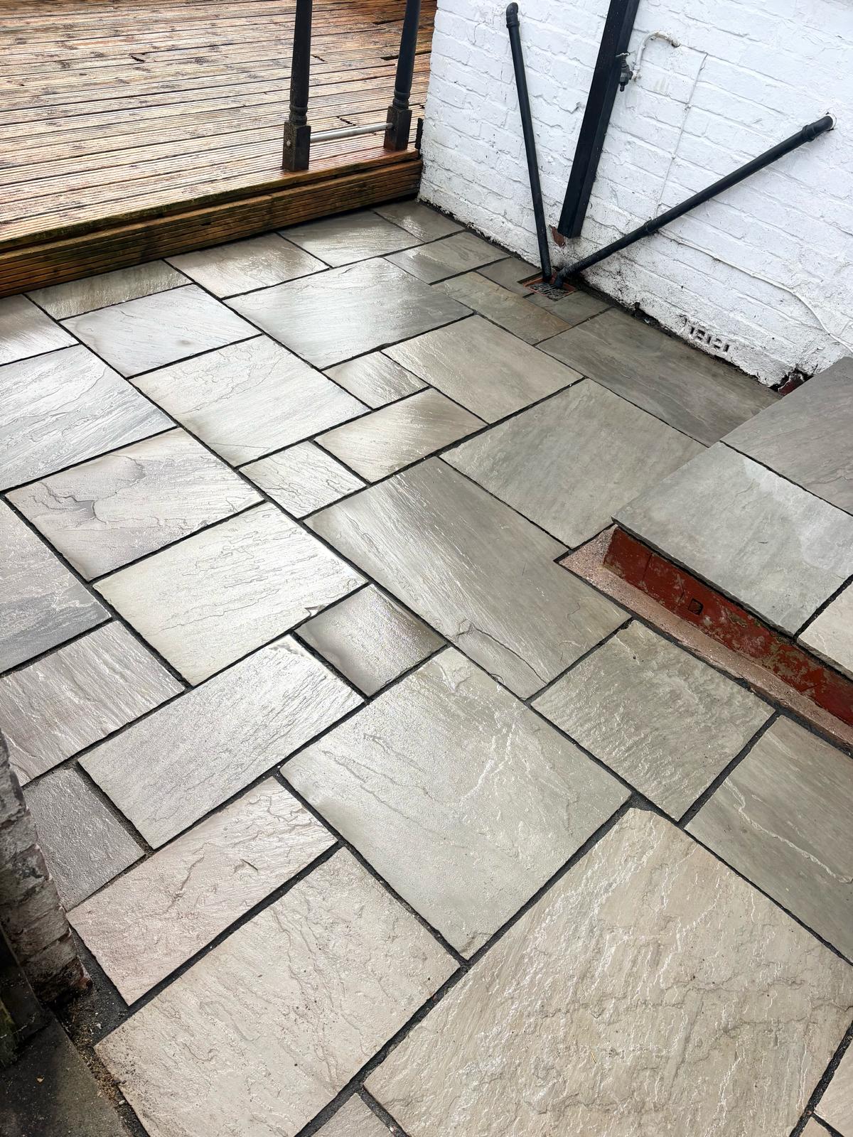 Indian sandstone patio cleaned and brought back to life by DR Elite