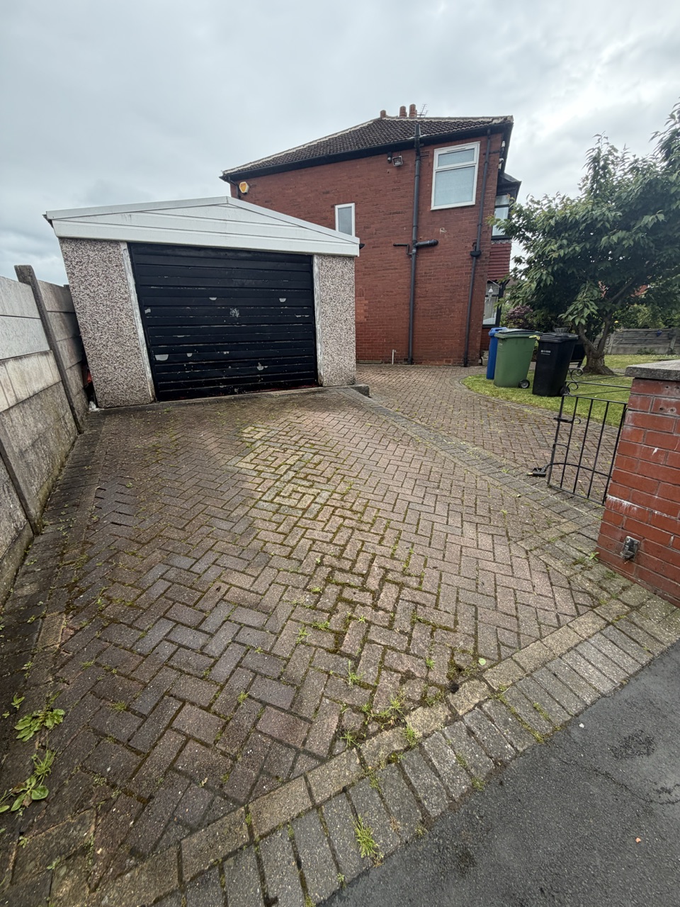 Before – a weed-covered block-paved driveway in Manchester brought right back to life.